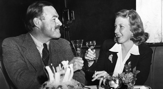 Ernest Hemingway drinking a martini with Martha Gelhorn